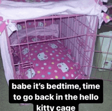 a pink cage with a hello kitty bedspread on it