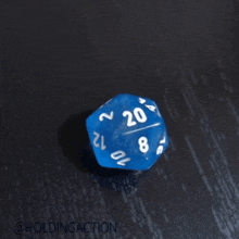 a blue dice with the number 20 on it is on a table