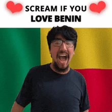 a man with glasses and a beard is screaming in front of a flag that says scream if you love benin