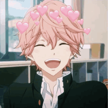 a boy with pink hair and hearts on his head