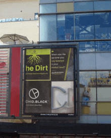 a billboard that says he dirt is on a building