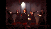 a group of girls in school uniforms are dancing