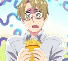 a man with glasses is holding a can of french fries with his mouth open