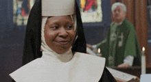 a nun is smiling in front of a priest