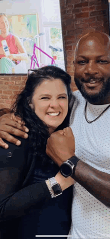 a man and a woman are posing for a picture together