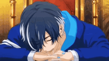 a man in a blue jacket is laying down on a throne with his head on his hands .