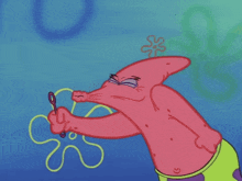 patrick star from spongebob is blowing soap bubbles with his eyes closed