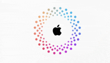 the apple logo is surrounded by a rainbow of dots