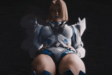 a woman in a white and blue outfit with a blue ribbon around her neck