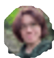 a blurry picture of a woman 's face with red hair