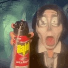 a man in a suit and tie is holding a raid ant spray .