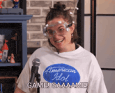 a woman wearing a shirt that says american idol game gaaame