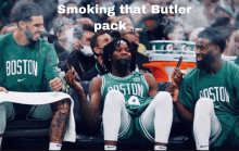 a group of boston basketball players smoking a pack