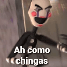 a puppet from five nights at freddy 's with the words `` ah como chingas '' on it 's face .