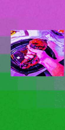 a person is holding a hamburger in their hand in a pixelated image