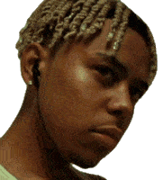 a close up of a man 's face with braids on his hair