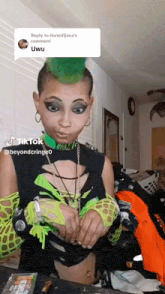 a woman with green hair has a reply to ihatedjana 's comment in a speech bubble