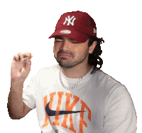 a man wearing a ny yankees hat and a white nike shirt