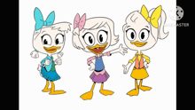 three cartoon duck girls are standing next to each other on a table .