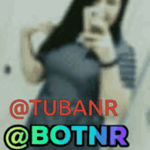 a blurry picture of a woman taking a selfie with the words " @tubanr @botnr "