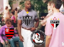 a man wearing a cam shirt is standing next to another man wearing a spfc shirt