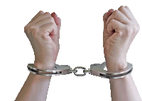 a person 's hands are in handcuffs and their fist is up