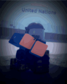 a united nations sign is behind a toy figure