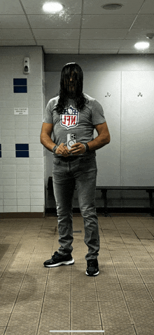 a man wearing a t-shirt with the nfl logo on it