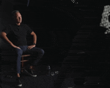 a man sitting in a chair with the words i think we 're done