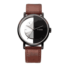 a tomi watch with a brown leather strap