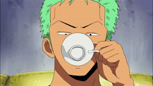 a man with green hair drinks from a white cup