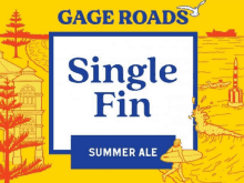 a label for a single fin summer ale with a drawing of a surfer on it .