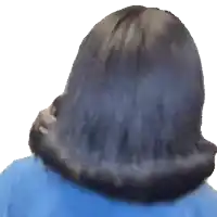 a close up of a woman 's hair with a blue jacket