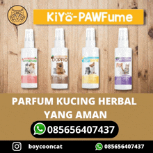 four bottles of kiyo pawfume on a wooden surface