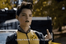 a woman in a x-men costume is giving the middle finger and says i only have 1 thing to say