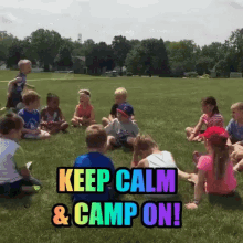 a group of children sit in a circle on a grassy field with the words keep calm and camp on