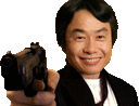 a man in a suit is holding a gun and smiling .