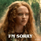 a woman with red hair says i 'm sorry in front of a netflix logo