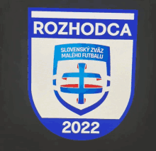 a blue and white emblem with the year 2022 on the bottom