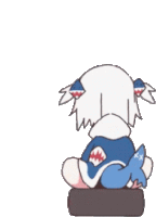 a cartoon character is sitting on a block with a fish tail on his back .