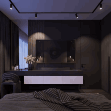 a bedroom with a large flat screen tv hanging from the ceiling