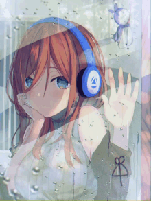 a girl wearing headphones and a sweater with the number 8 on it