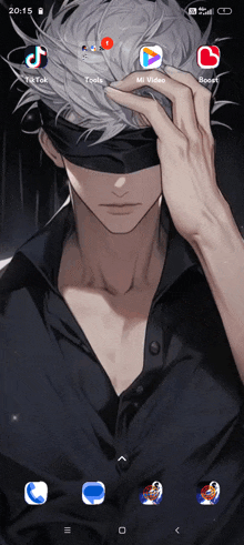 a screenshot of a phone screen shows a man wearing a black shirt and a blindfold