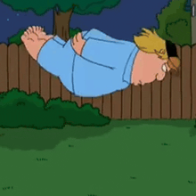 a cartoon character is sleeping on a fence in the grass .