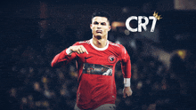 a soccer player wearing a red jersey with the word cr7 on the bottom