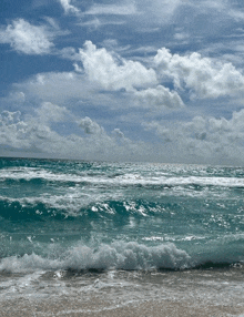 a large body of water with waves crashing against the shore