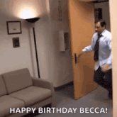 a man in a blue shirt and tie is opening a door in a room .