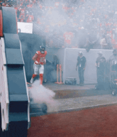 a football player in a red uniform with the number 10 on his jersey
