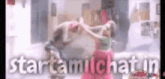 a man and a woman are dancing in a room with the words startamichat in the corner .