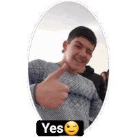 a young man is giving a thumbs up with a yes smiley face